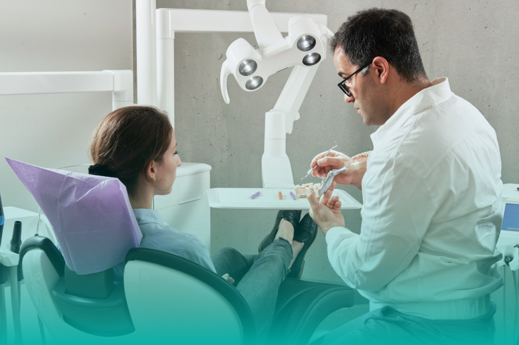Dentist talking through procedure with dental patient 